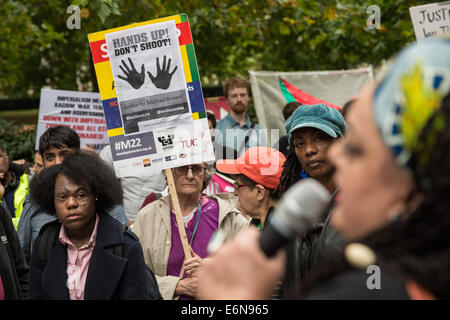 London, UK. 27th August, 2014. ‘Hands Up Don’t Shoot!’ protesters and supporters from Stand Up To Racism and Unite Against Fascism protest outside the US Embassy in London in solidarity for the recent death of Michael Brown. On August 9, 2014, Michael Brown Jr., an 18-year-old African American man, was fatally shot by 28-year-old white Ferguson police officer Darren Wilson in the city of Ferguson, Missouri, US. Credit:  Guy Corbishley/Alamy Live News Stock Photo