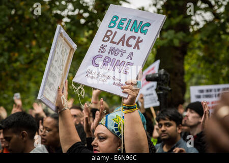 London, UK. 27th August, 2014. ‘Hands Up Don’t Shoot!’ protesters and supporters from Stand Up To Racism protest outside the US Embassy in London in solidarity for the recent death of Michael Brown. On August 9, 2014, Michael Brown Jr., an 18-year-old African American man, was fatally shot by 28-year-old white Ferguson police officer Darren Wilson in the city of Ferguson, Missouri, US. Credit: Guy Corbishley/Alamy Live News Stock Photo