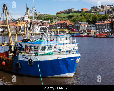 Fishing trawlers in the harbour at Whitby, North Yorkshire, England Stock Photo