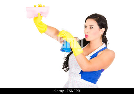 Beautiful young girl wearing apron and gloves cleaning Stock Photo