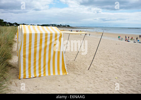 Beach shelters on Carnac Plage, Brittany, France Stock Photo