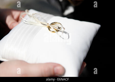 wedding rings on pillow served the bridal couple Stock Photo