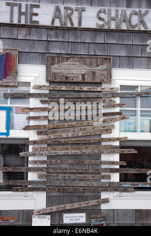 Carved wooden signs for sale on Cape Cod. Stock Photo