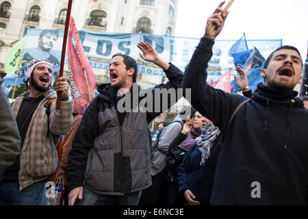 Buenos Aires, Argentina. 27th Aug, 2014. Militants of left-wing parties and social organizations take part in a protest in front of the building of the municipal government in Buenos Aires, capital of Argentina, on Aug. 27, 2014. A 24-hour strike, proposed by the General Confederation of Workers and the Confederation of of Argentine Workers, is to take place on Thursday to protest against the economic and employment crises in the country, according to the local press. Credit:  Martin Zabala/Xinhua/Alamy Live News Stock Photo