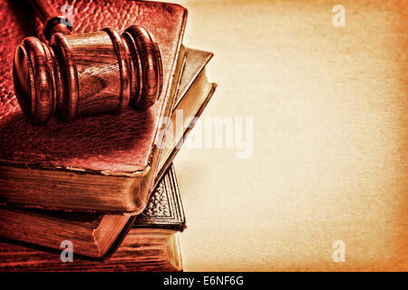 Gavel and Old Books  - gavel, a pile of books, and space for text on textured background. Stock Photo
