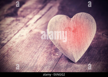 Vintage style heart on rustic wooden background, text space. Stock Photo