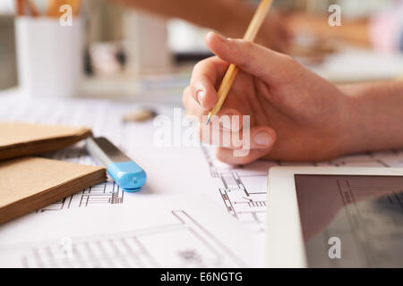 Hand of architect with pencil making sketch Stock Photo
