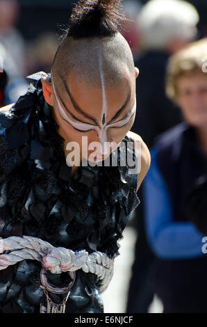 Japanese dancer with strange make-up promoting a show at the annual Festival Fringe in Edinburgh, Scotland. Stock Photo