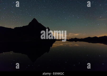 Anayet Peak at night, reflected on Ibon de Anayet (Anayet Lake). Pyrenees. Huesca province. Aragon. Spain. Stock Photo