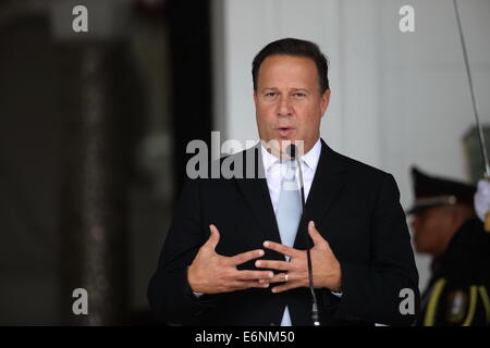 (140828) -- PANAMA CITY, Aug. 28, 2014 (Xinhua) -- Panama's President, Juan Carlos Varela, talks to media representatives, after his meeting with his Guatemalan counterpart, Otto Perez Molina, in the Presidential Palace, in Panama City, capital of Panama, on Aug. 27, 2014. Guatemala's President, Otto Perez Molina, is on Panama in an one-day official visit in which a bilateral tourism cooperation agreement will be signed. (Xinhua/Mauricio Valenzuela) (rt) (lmz) Stock Photo