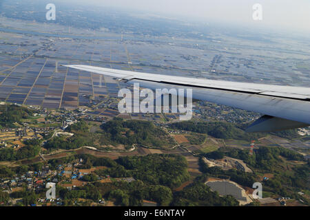 view from a plane on wing and on rural Japan Stock Photo
