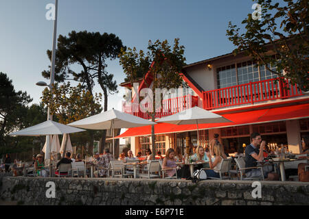 Customers eating at an outside restaurant on the promenade at Conche de Saint Palais near Royan. Stock Photo