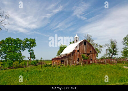 Kansas Red and White Barn with blue sky,white clouds, with tree's and ...