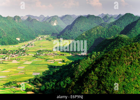 Aerial view of multiple mountain peaks and rice field in Vietnam Stock Photo