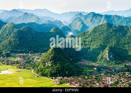 Aerial view of multiple mountain peaks in Vietnam with minorities' residential areas at the bottom Stock Photo