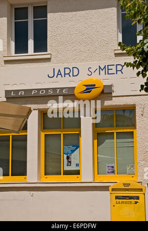 The French equivalent of the Royal Mail is La Poste, recognisable by the yellow signs, window surrounds, letter boxes and bikes. Stock Photo