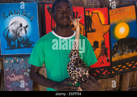 The market at Mukuni Village is a gem of an African bazaar near the Victoria Falls in Zambia. Shopper and vendor can interact ov Stock Photo