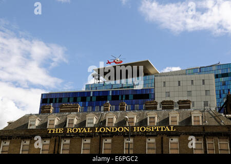 Air ambulance emergency helicopter landing on The Helipad on the roof of The Royal London Hospital Tower Hamlets London England Stock Photo