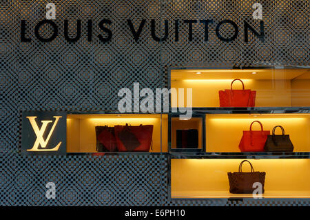 Louis Vuitton women's handbags displayed in the window of Holt Renfrew department store, Vancouver, BC, Canada Stock Photo