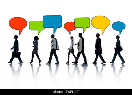 Silhouettes of Business People and Speech Bubbles Stock Photo