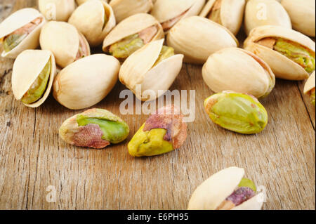 pistachio nuts on wooden table background Stock Photo