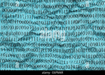Crushed blue paper with binary code. Close-up. Stock Photo