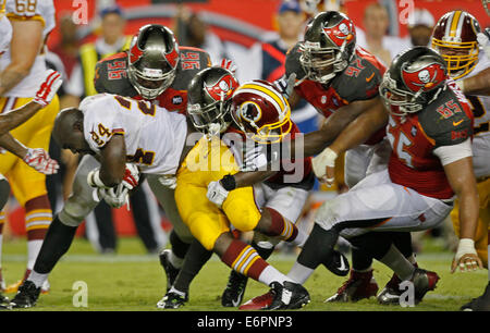 Tampa, Florida, USA. 28th August, 2014. Washington's Silas Redd (24) loses his helmet in the 4th qtr during the Tampa Bay Buccaneers preseason game against the Washington Redskins at Raymond James Stadium Thursday night 8/28/2014. (Credit Image: Credit:  Jim Damaske/Tampa Bay Times/ZUMA Wire/Alamy Live News) Stock Photo