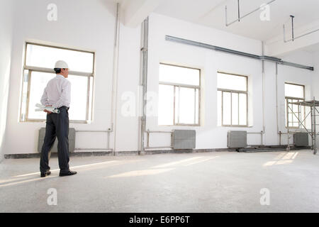 Pensive contractor on construction site Stock Photo