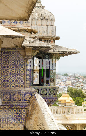 View out at the ornamental windows with decorative tiling and carved marble balconies of City Palace Udaipur, Rajastan, India Stock Photo