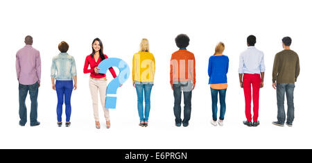 People Facing Backwards with Woman Holding Question Mark Stock Photo