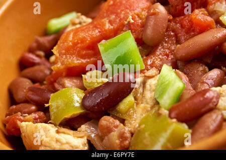 Chili con carne - in American English as simply “chili”, is a spicy stew containing chili peppers, meat (usually beef), tomatoes Stock Photo