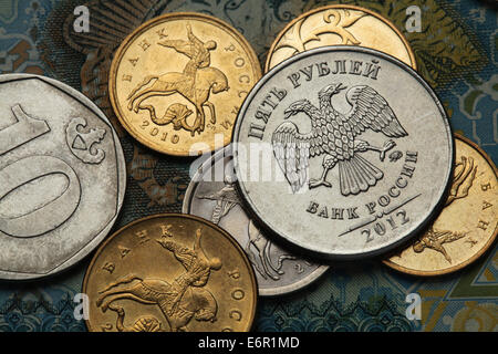 Coins of Russia. Saint George killing the Dragon depicted in Russian kopek coins and Russian two-headed eagle at roubles coin. Stock Photo