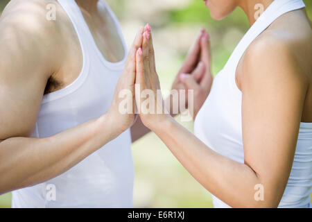 Young couple practicing yoga Stock Photo