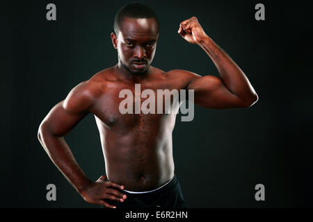 Strong young man showing his muscular Stock Photo