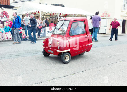 Peel P50 car being driven in Peel, Isle of Man Stock Photo