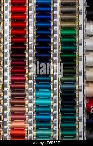 Cotton reels display in haberdashery. Racks of cotton reels. Norfolk, UK Stock Photo