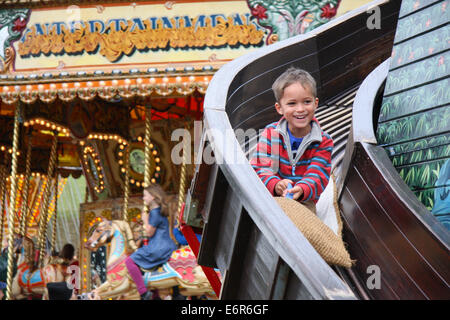 Peak District, Derbyshire, UK. 29 August 2014. The helter skelter proves a draw for those attending the Chatsworth Country Fair held in parkland surrounding the Derbyshire stately home.  Credit:  Matthew Taylor/Alamy Live News Stock Photo