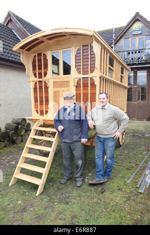 Traditional wheelwright Greg Rowlands with father Mike working on a new Wagon Colyton Devon Stock Photo