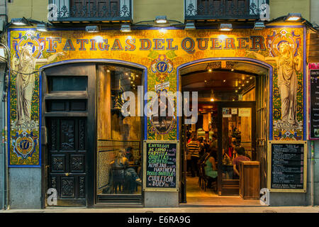 Night exterior view of a bar restaurant in Calle de la Cruz, Madrid, Comunidad de Madrid, Spain Stock Photo