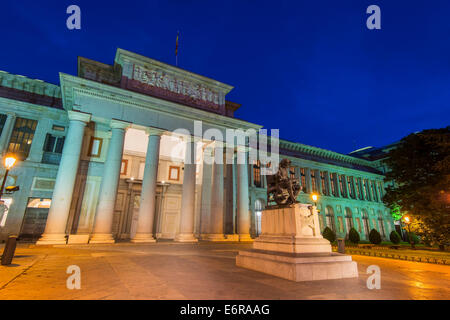 Night view of the facade of Museo del Prado with bronze statue of spanish painter Diego Velazquez, Madrid, Spain Stock Photo