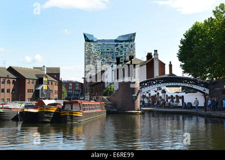 Birmingham canals waterways narrowboats at Broad Canal Basin with the Cube building Uk Stock Photo