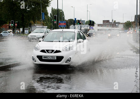 Manchester, UK. 29th August, 2014. Weather: Heavy rain during the early evening makes driving conditions hazardous during rush hour in Manchester. Credit:  Russell Hart/Alamy Live News. Stock Photo