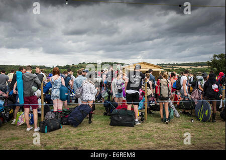 Stow Maries, UK. 29th August 2014. Young festivalgoers queue patiently at the Brownstock festival. The Brownstock Festival celebrates it's 10th anniversary. Credit:  Gordon Scammell/Alamy Live News Stock Photo