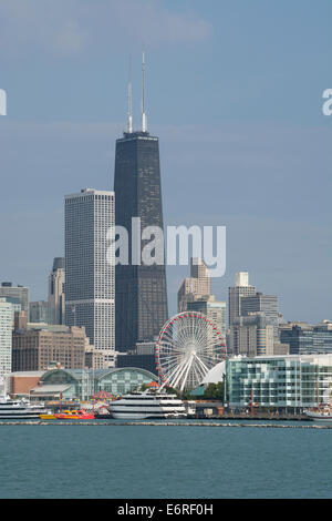 Illinois, Lake Michigan, Chicago. Navy Pier with Chicago city skyline in distance, including the John Hancock. Stock Photo