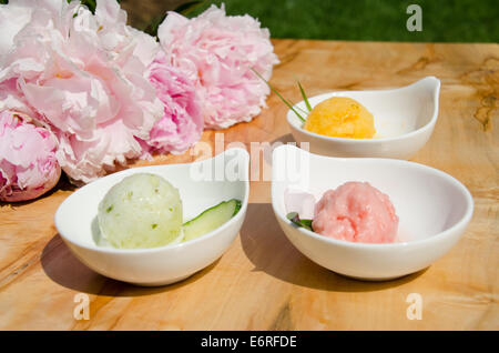 Three bowls, each with one scoop of sorbet, gelato or ice cream Stock Photo