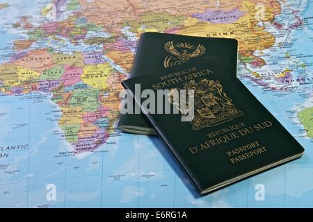 South African Passport with the World map in the Background Stock Photo