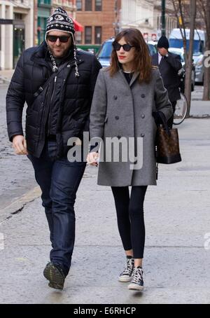 Alexa Chung smoking a cigarette in the East Village as she walks with a friend  Featuring: Alexa Chung Where: New York City, New York, United States When: 24 Feb 2014 Stock Photo