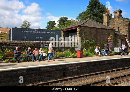 Tourists on Goathland Railway Station platform, North Yorkshire, North York Moors National Park, England, UK. Stock Photo