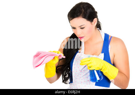 Beautiful young girl wearing apron and gloves cleaning Stock Photo