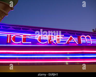 A retro-cool blue and red neon ice cream sign at dusk Stock Photo